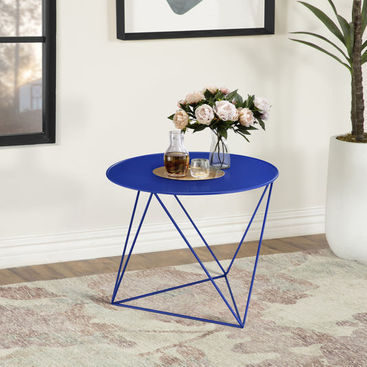 Vibrant blue metal round accent table with geometric legs holding decorative vase and carafe