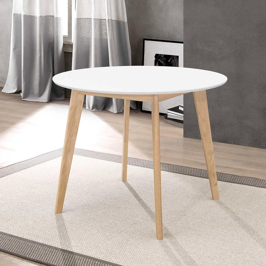 Round white modern dining table with light wood tapered legs