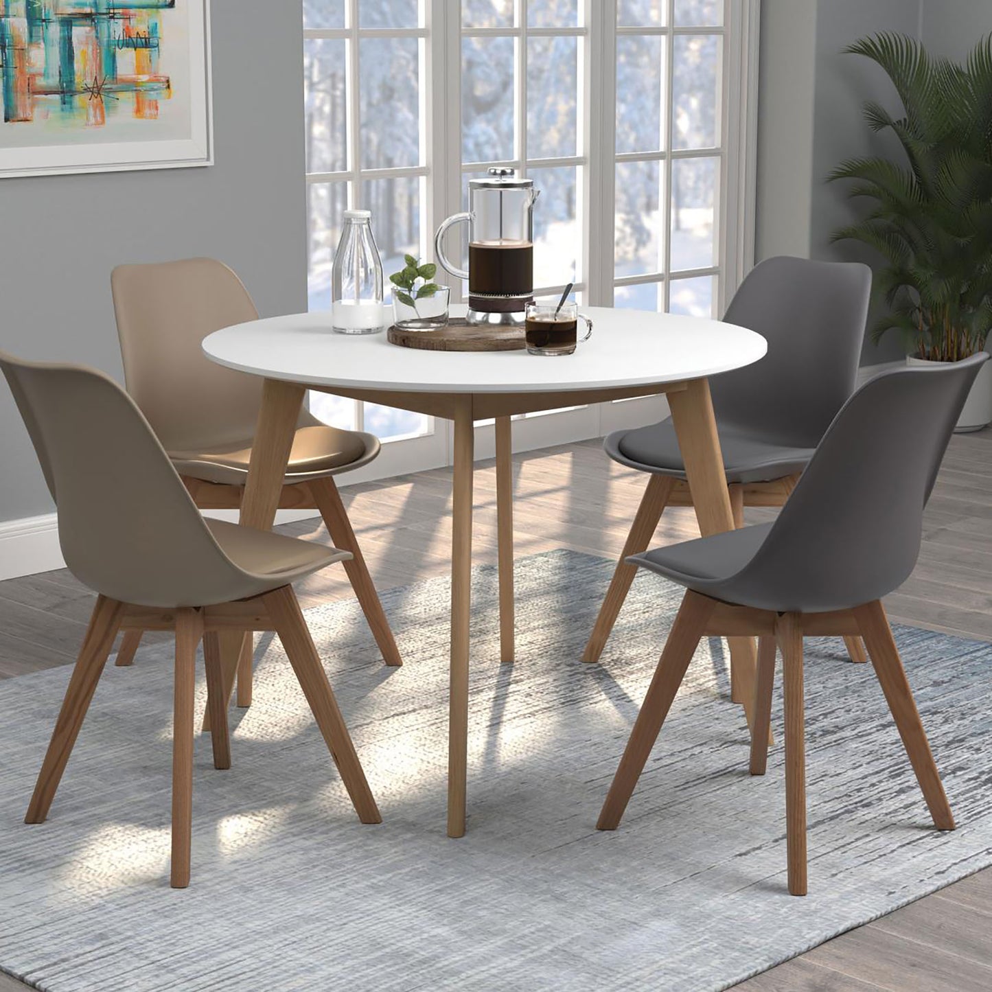 Modern white round dining table with taupe and gray chairs