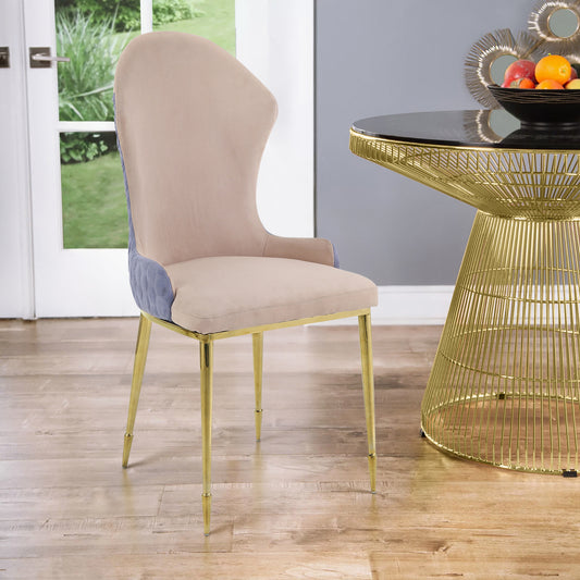 Cream velvet dining chair with blue quilted side panels and gold legs