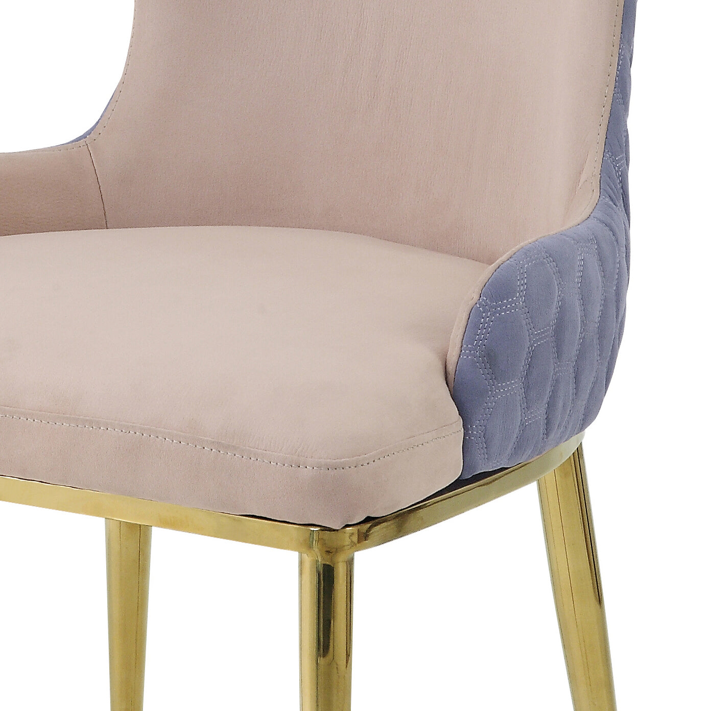 Beige upholstered dining chair with blue quilted accents and gold legs