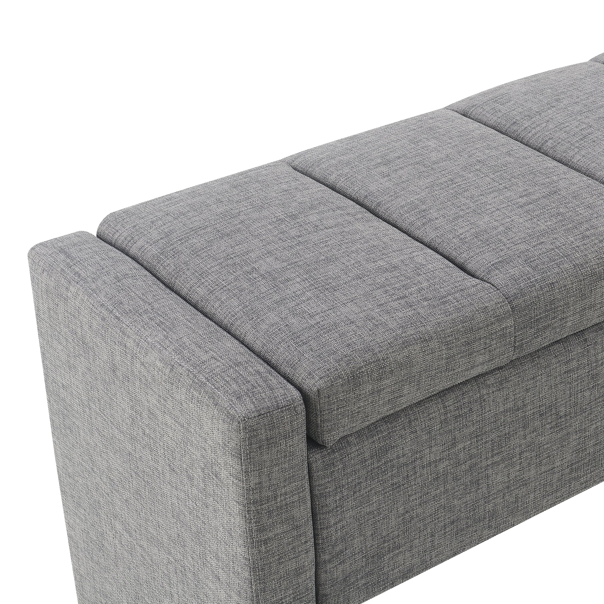 Gray fabric storage ottoman with tufted top and clean lines