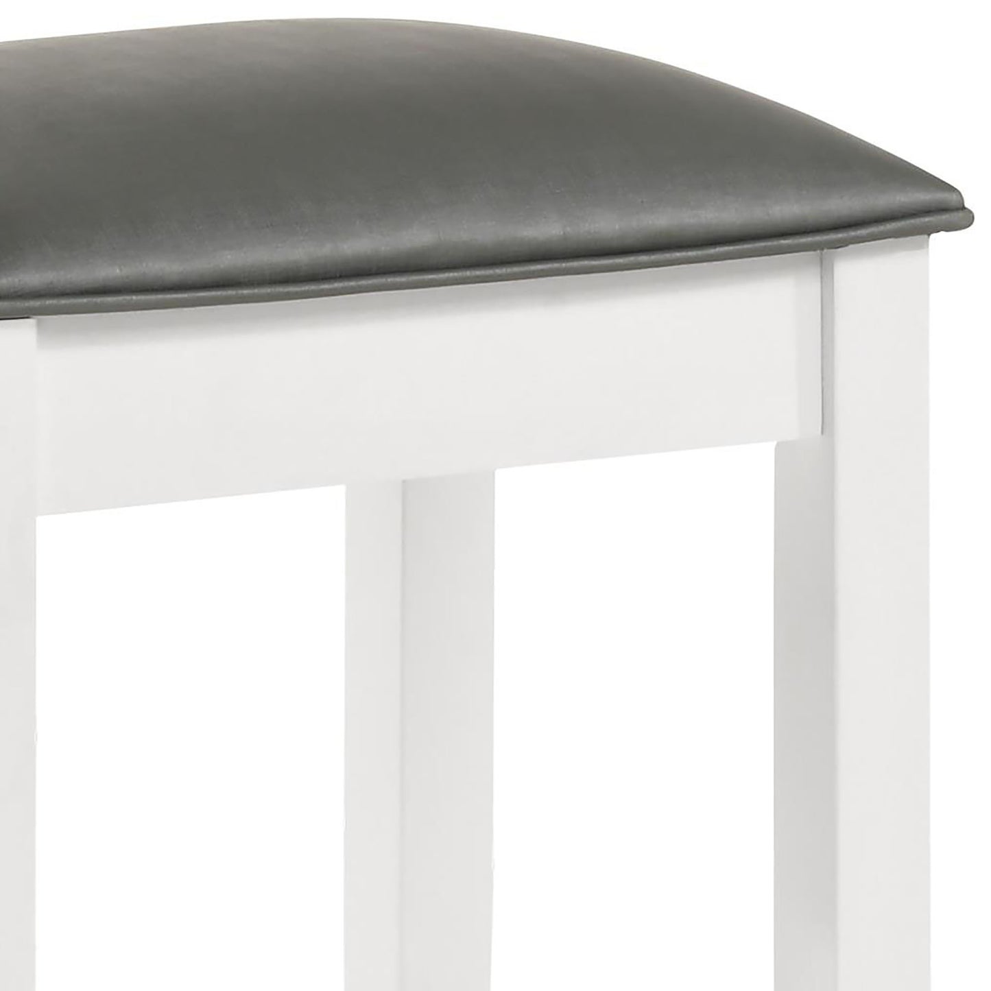 Closeup of a plush dark grey faux leather stool seat with a white wood base