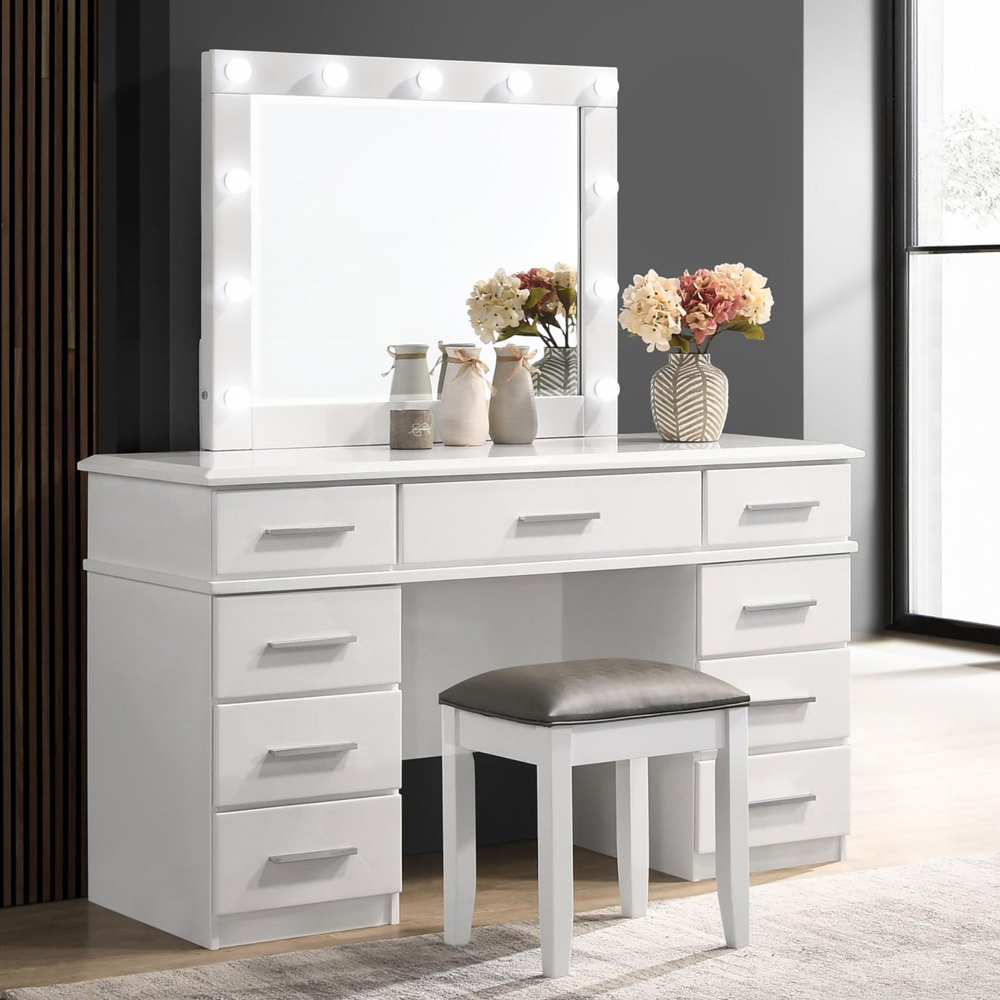 White vanity table with illuminated mirror and padded stool