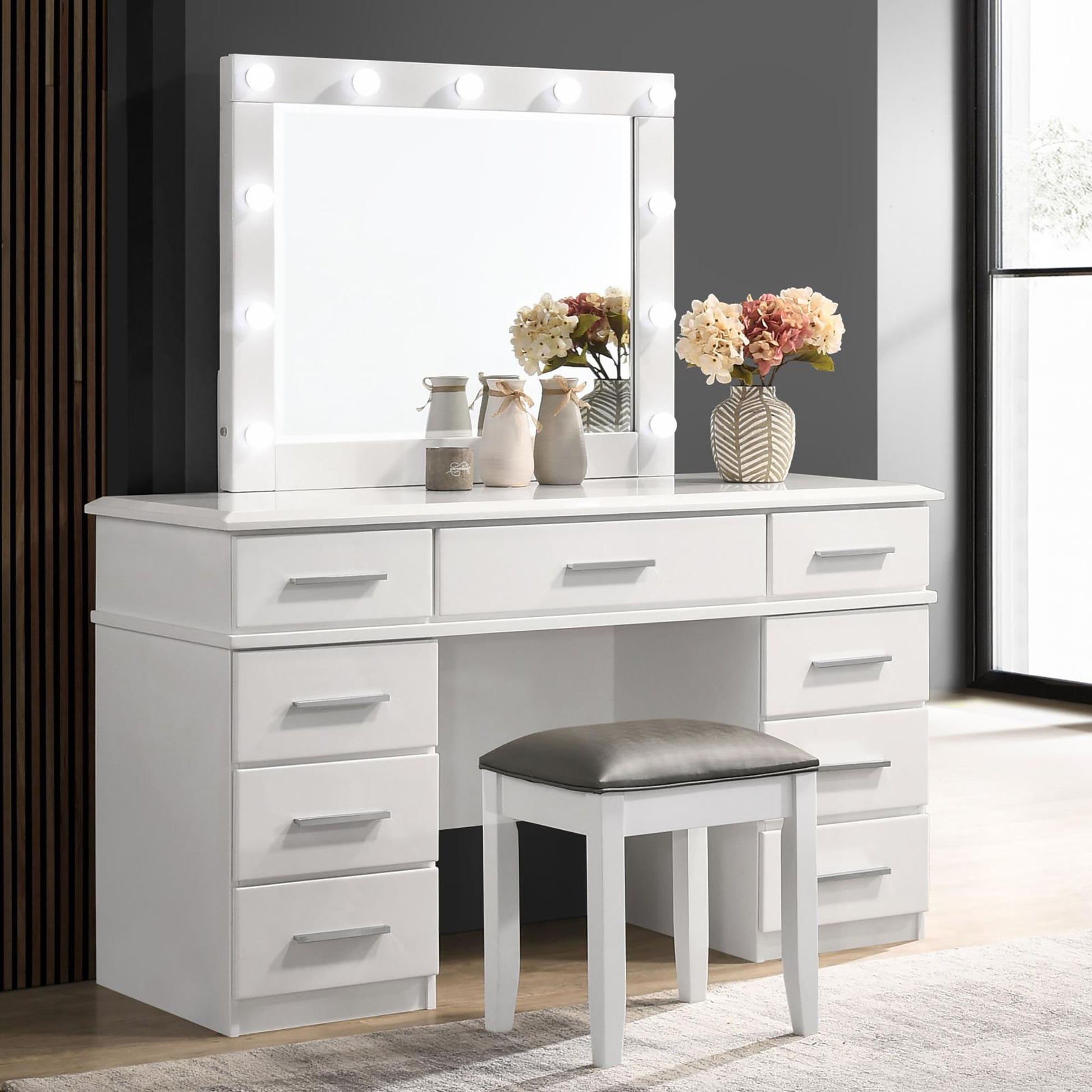White vanity table with illuminated mirror and padded stool