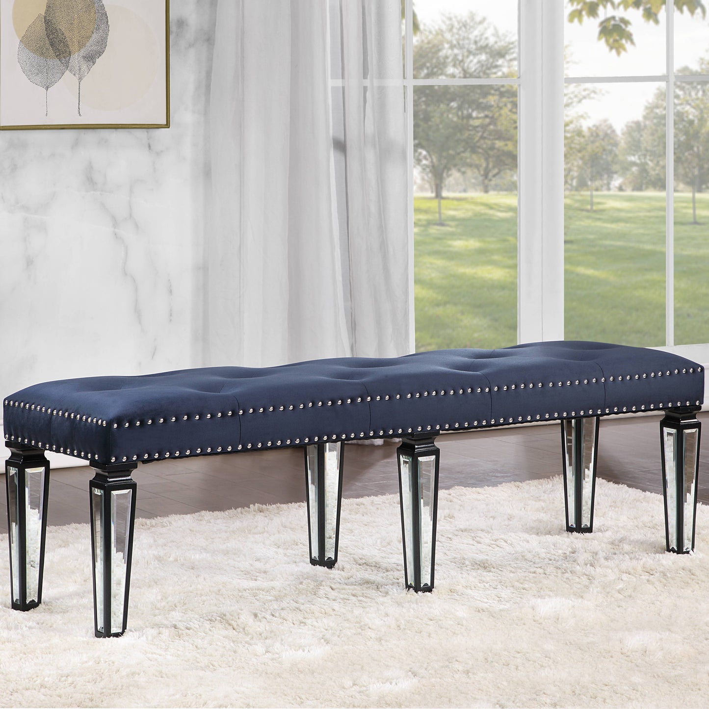 Tufted navy velvet bench with crystal legs and silver nailhead trim