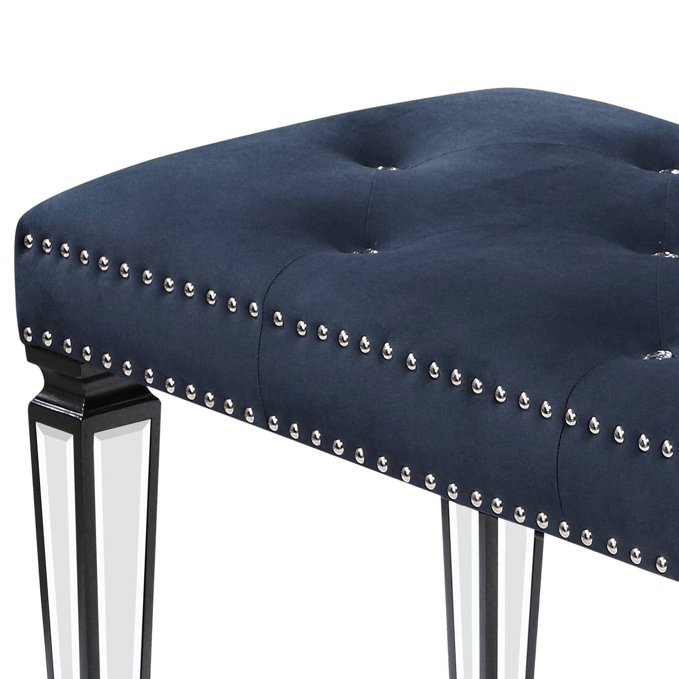 Navy velvet tufted bench with silver nailhead trim and mirrored legs