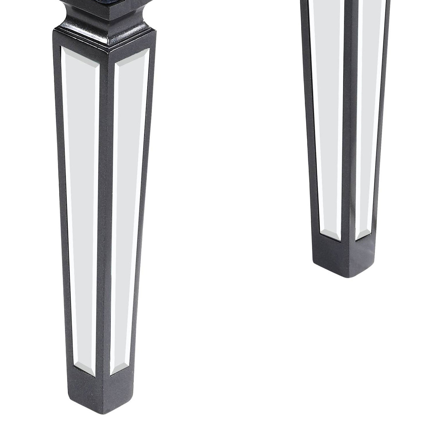 Black mirrored furniture leg with beveled detailing for a glamorous touch