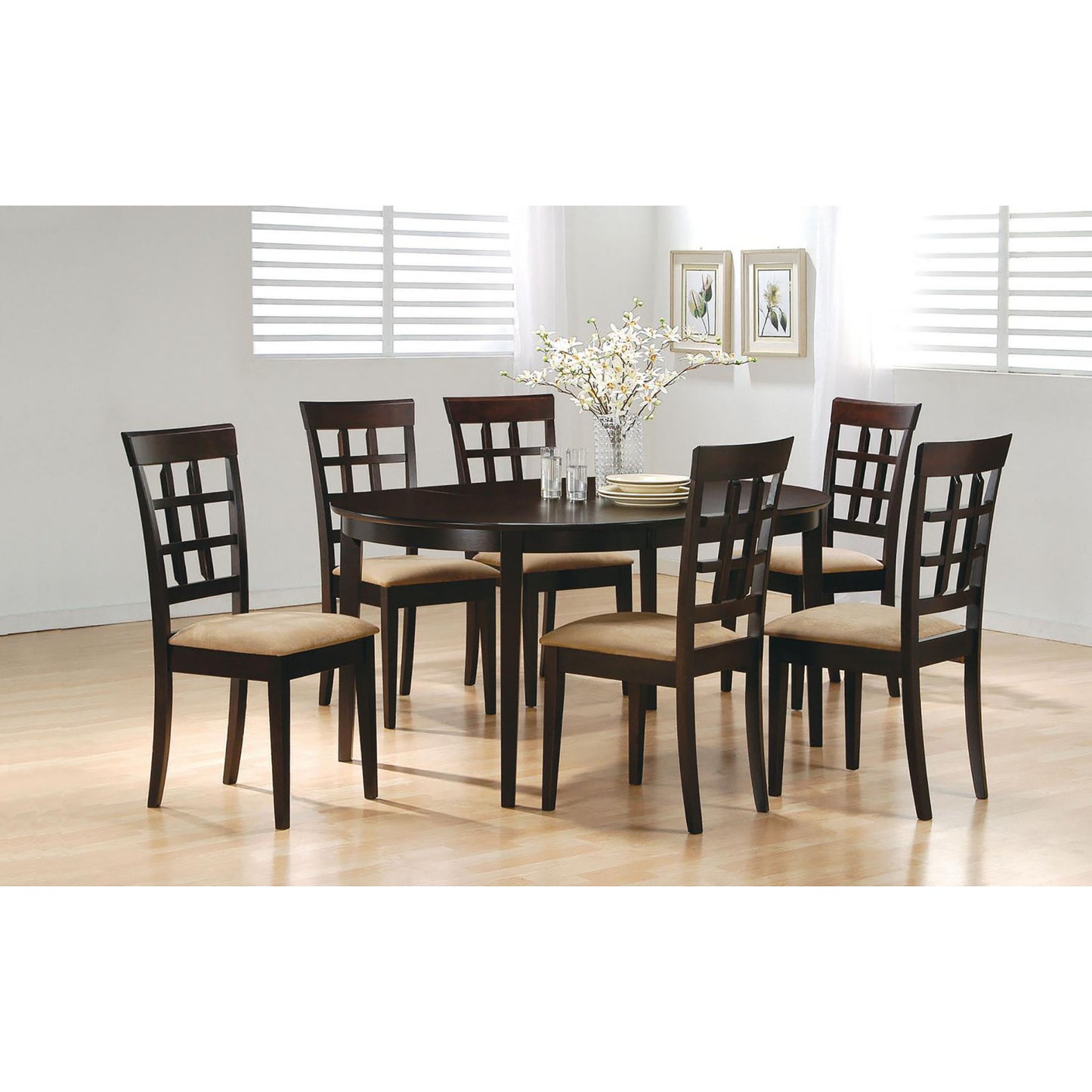 Dark wood oval dining table with six slatback chairs and upholstered seats