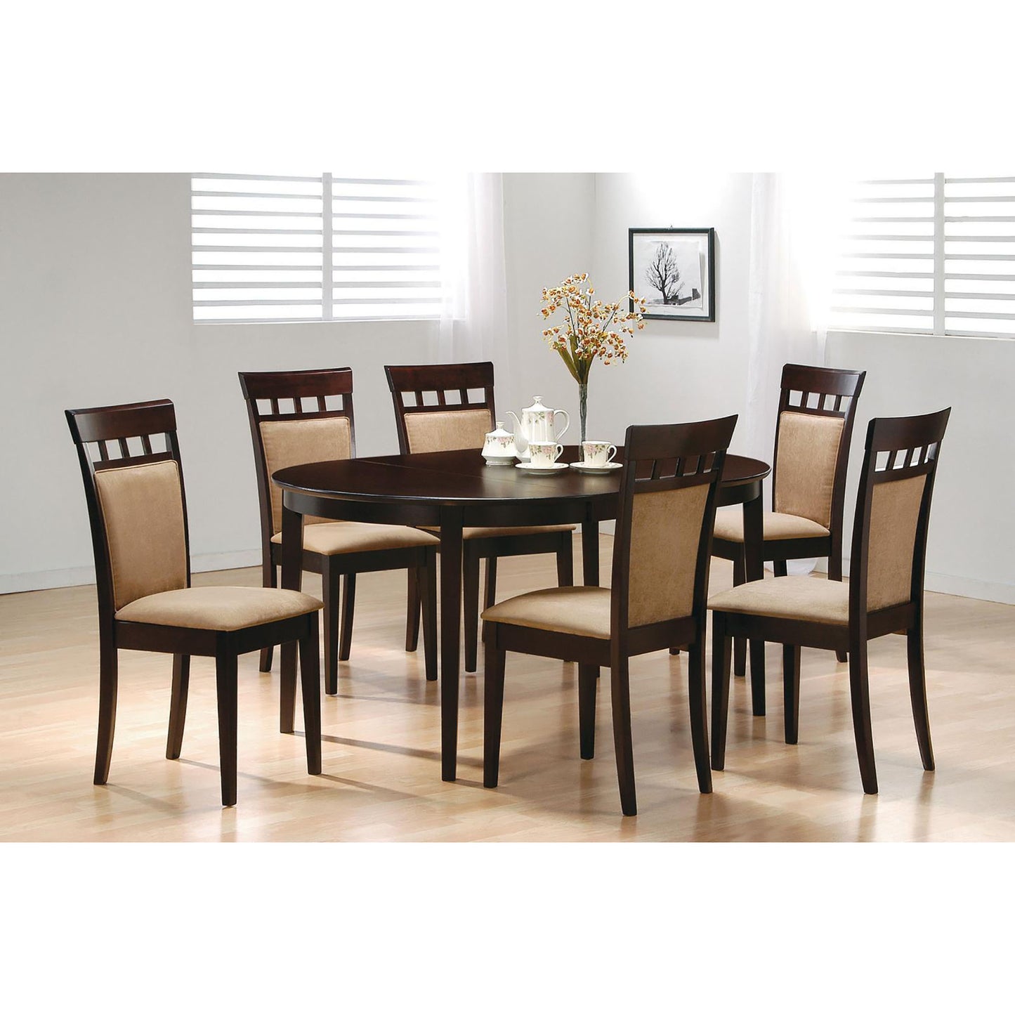 Dark wood oval dining table with six upholstered chairs in tan fabric