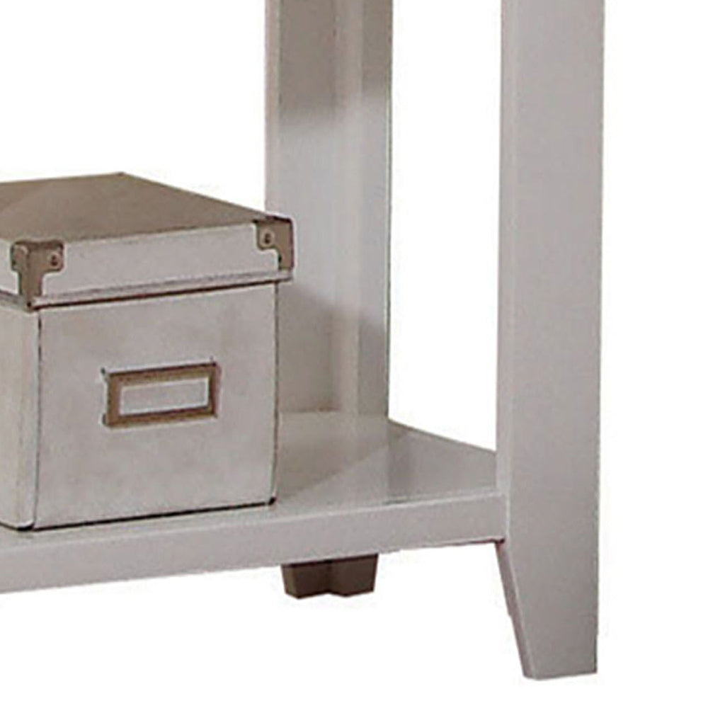 White distressed storage box with metallic accents on a shelf