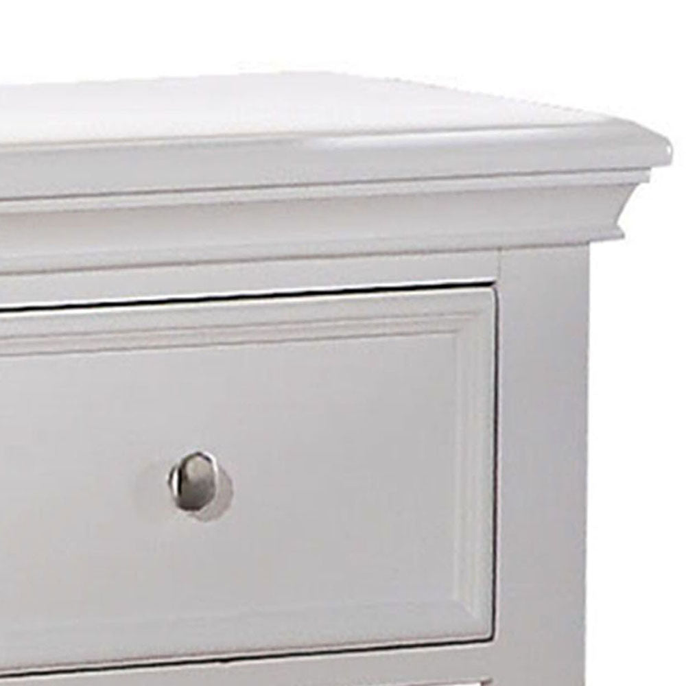 Closeup of white wooden dresser drawer with silver knob classic design