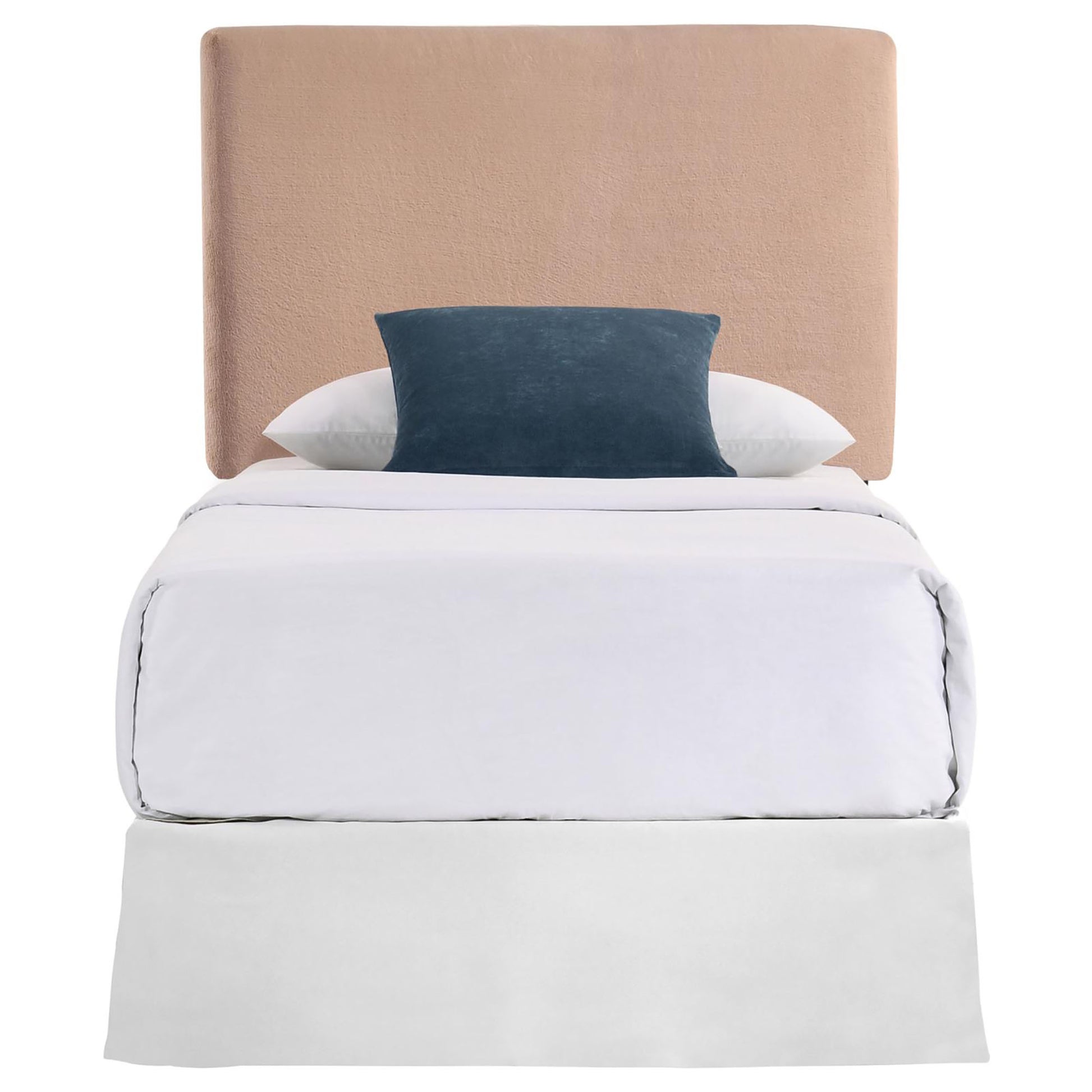 Single bed with plush tan headboard and crisp white bedding