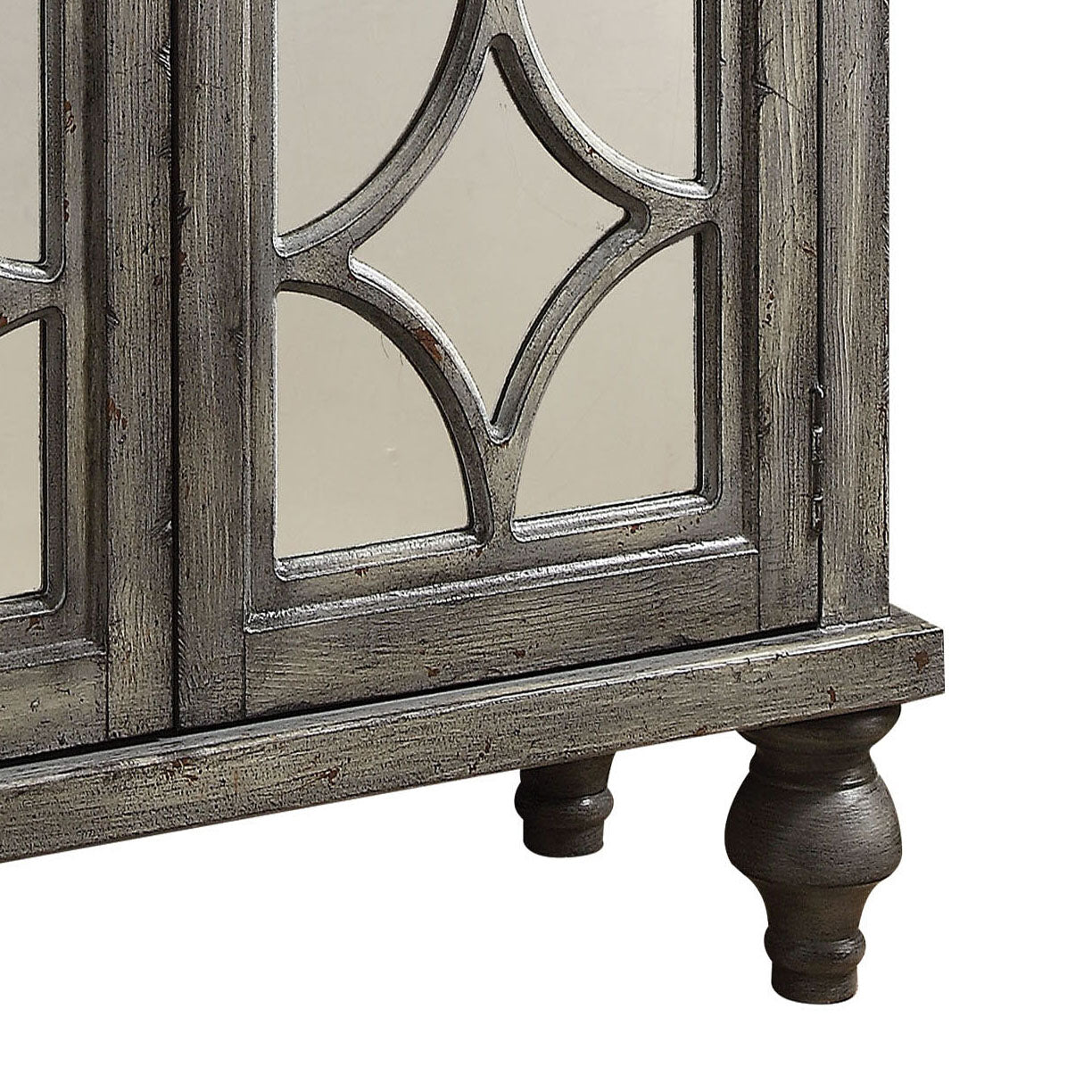 Distressed gray accent cabinet with mirrored inset doors and carved detailing