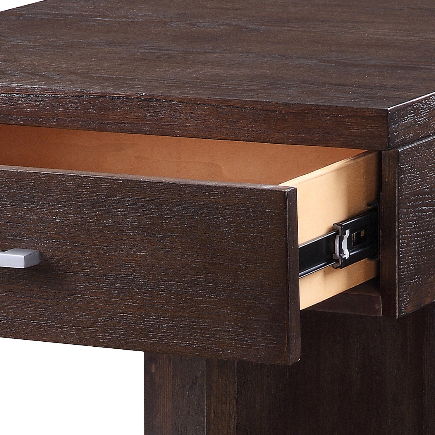 Dark wood dresser drawer with a modern silver handle and visible ballbearing slides