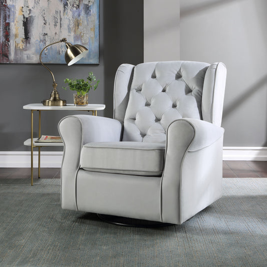 Tufted light gray velvet glider chair with rolled arms perfect for nursery comfort