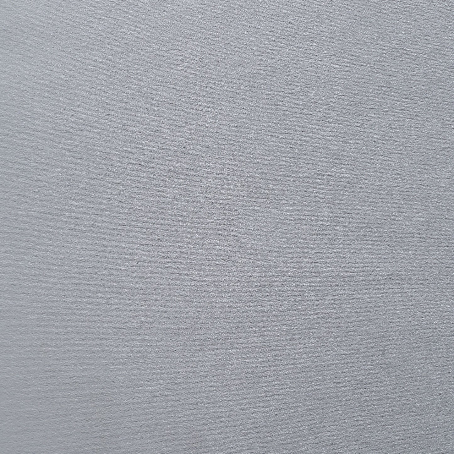 Closeup texture of a matte silver textured paper ideal for invitations or craft projects
