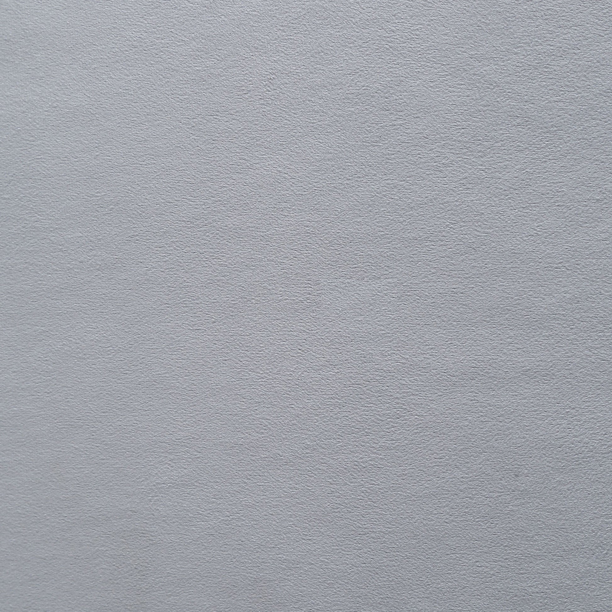 Closeup texture of a matte silver textured paper ideal for invitations or craft projects