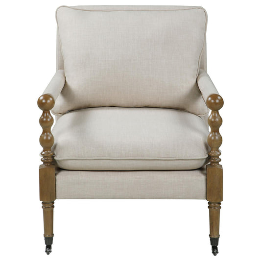 Textured cream linen armchair with carved wooden arms and caster wheels
