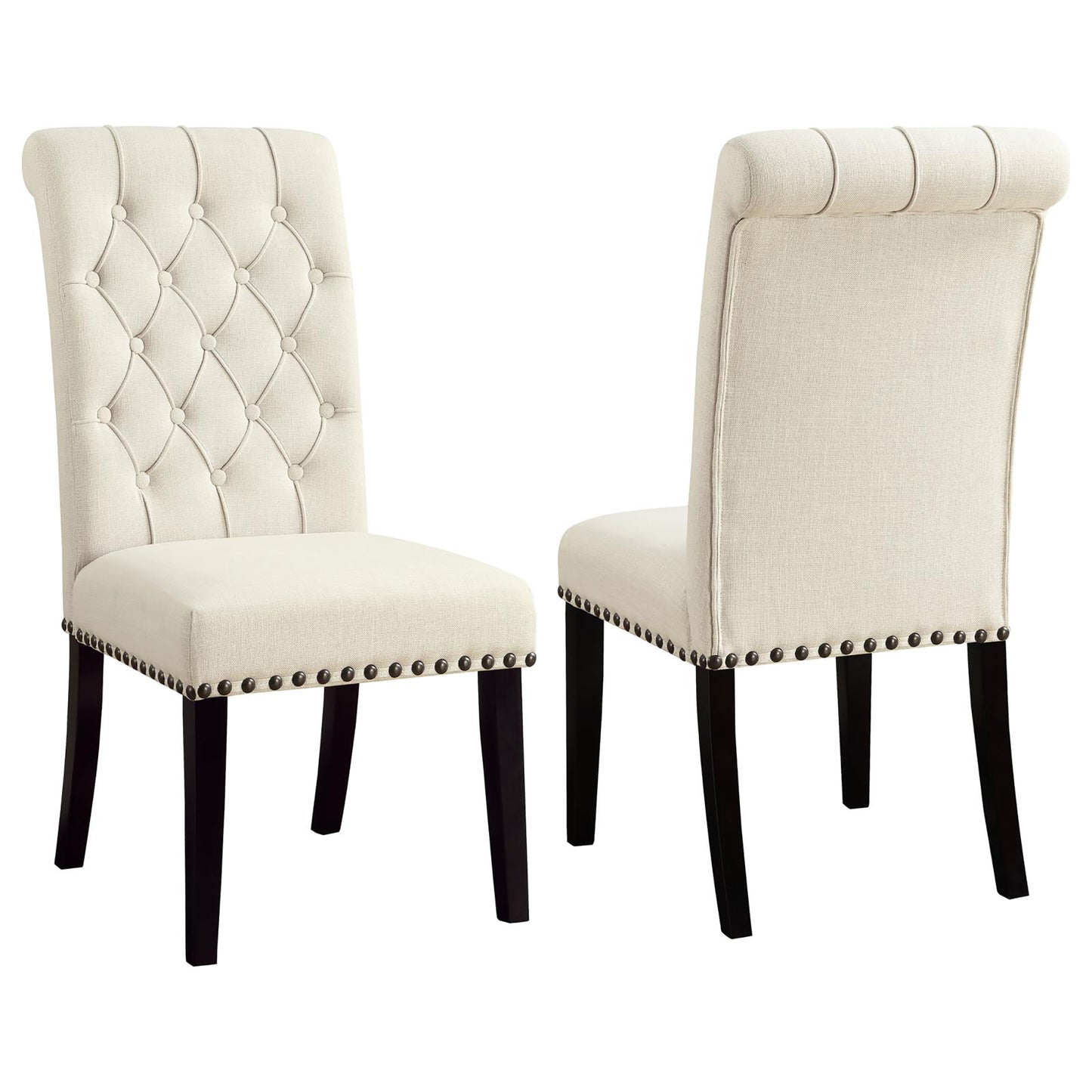 Tufted cream fabric dining chair with dark wood legs and decorative nailhead trim