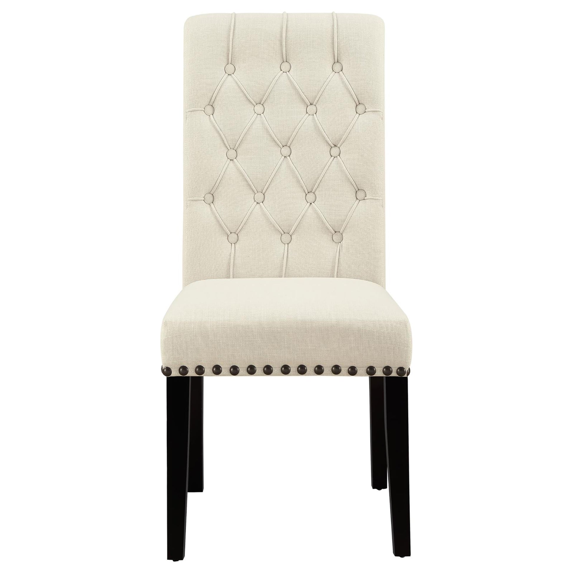 Tufted back cream upholstered dining chair with nailhead trim and dark wood legs