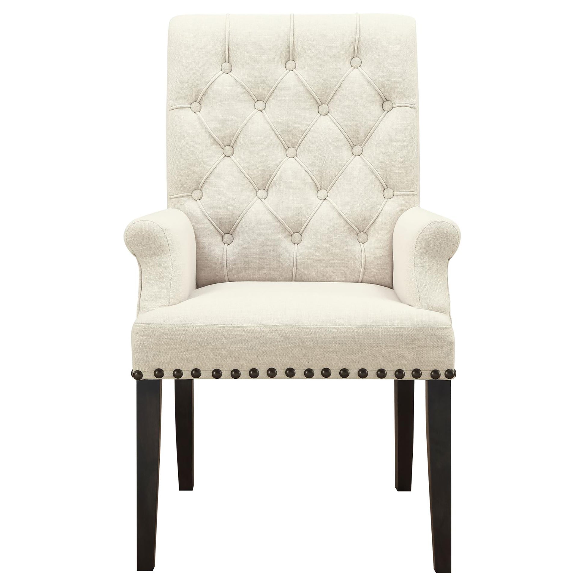 Cream upholstered armchair with diamond tufting and nailhead trim details
