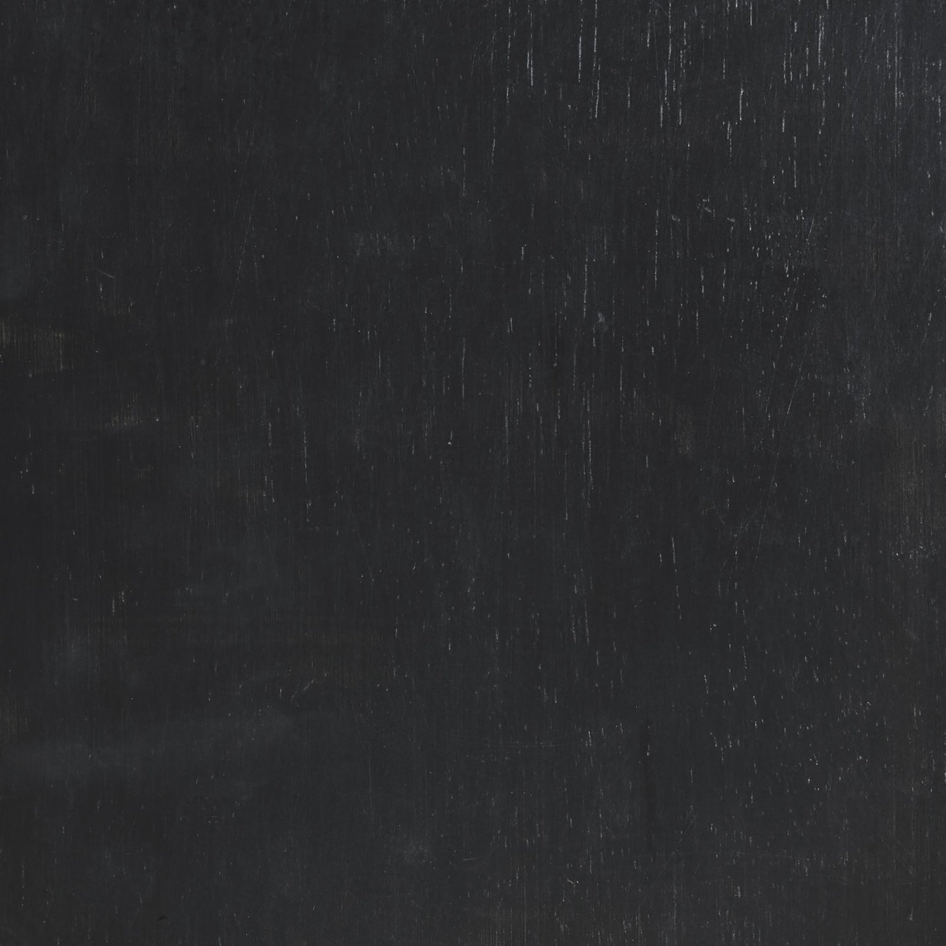 Dark gray textured surface with faint vertical scratches and subtle sheen
