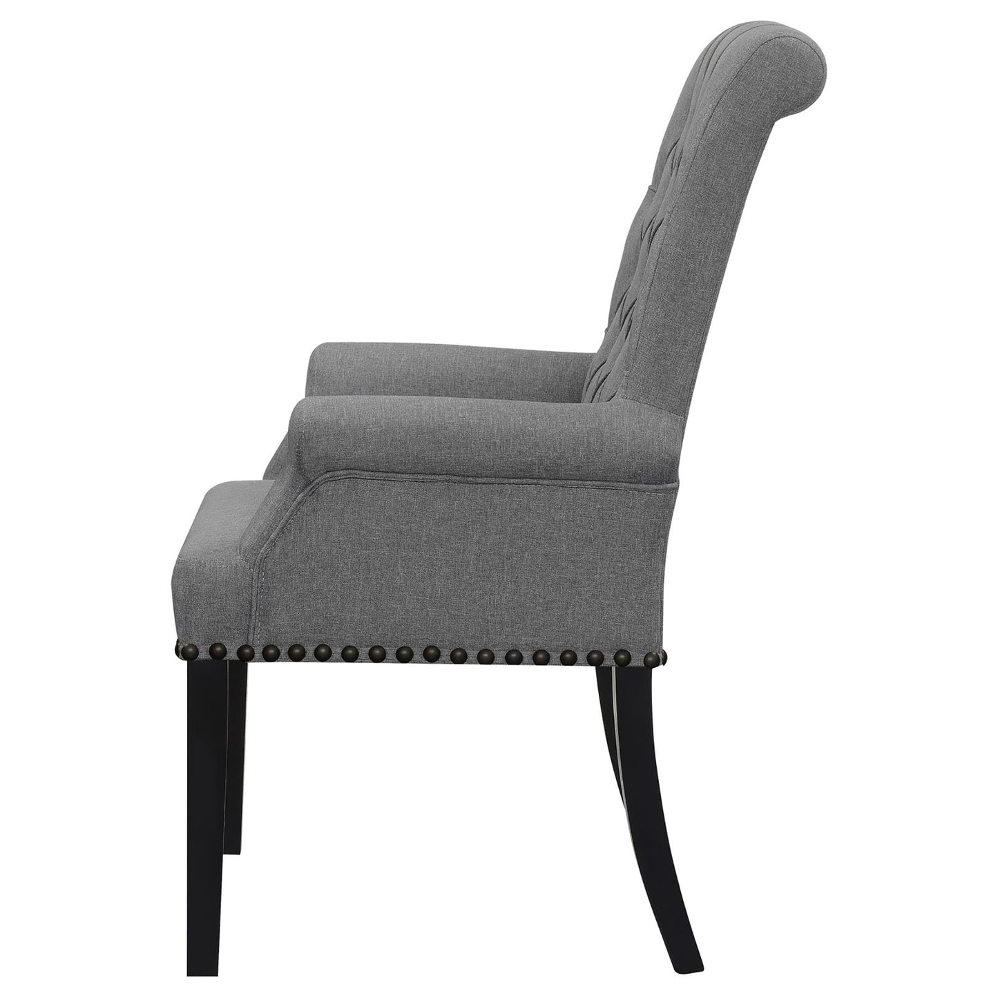 Gray upholstered armchair with diamond tufting and nailhead trim accents