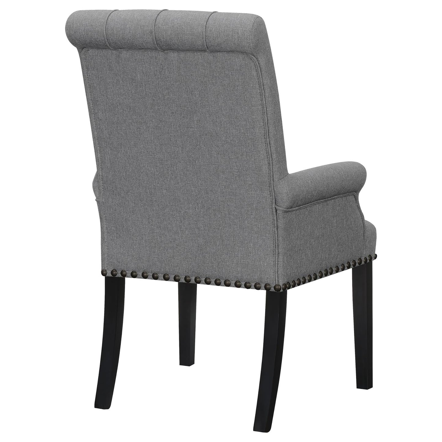 Grey fabric armchair with tufted back and nailhead trim