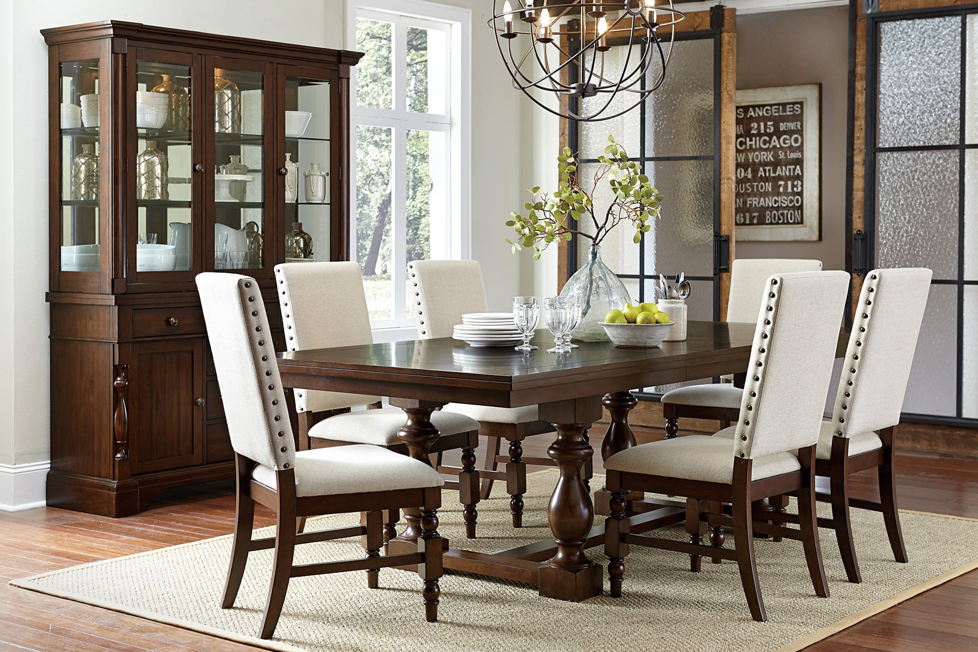 Dark wood dining table with pedestal base and upholstered chairs elegant dining room set