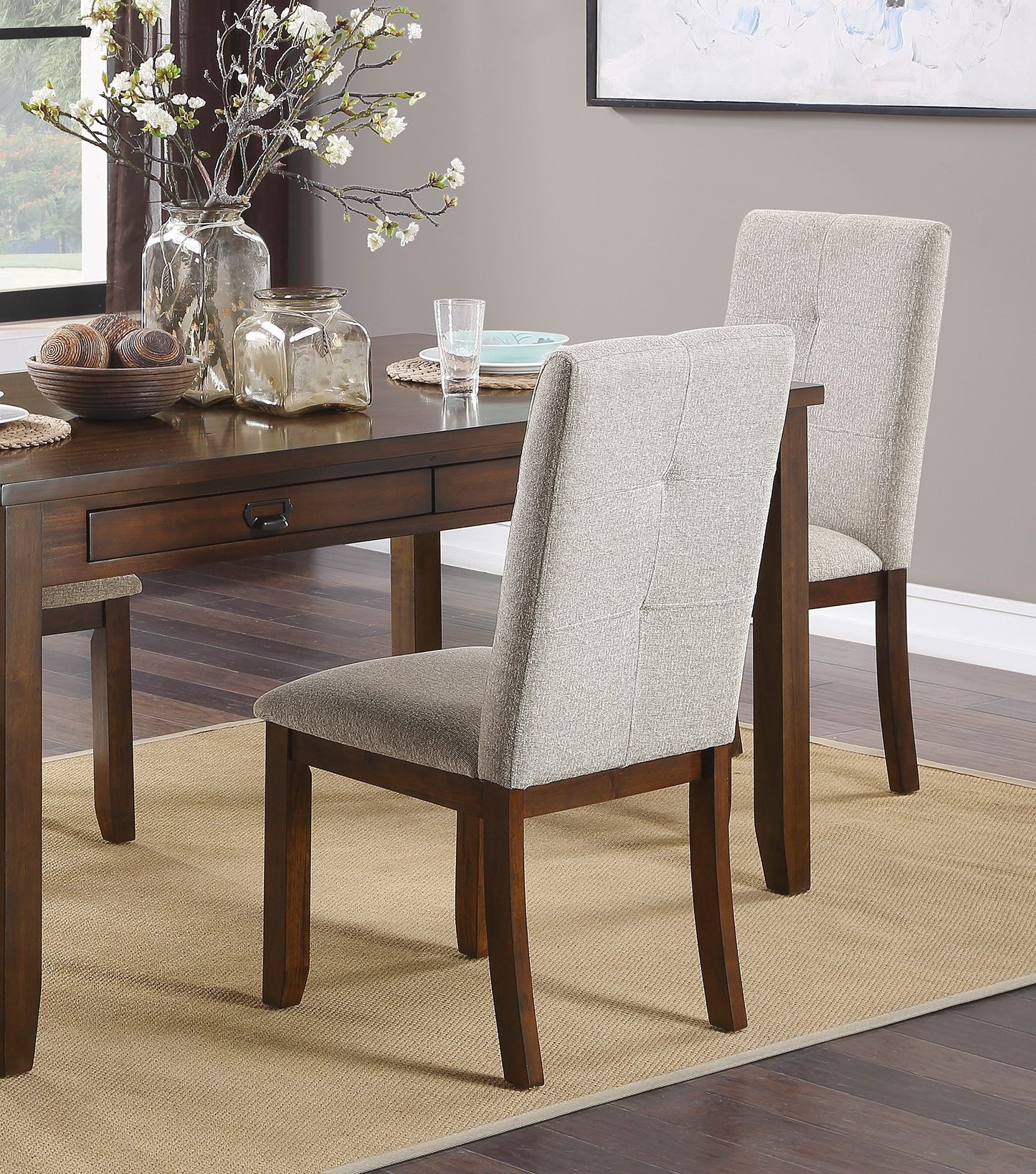 Elegant upholstered dining chair with tufted back and dark wood legs complementing a modern dining table