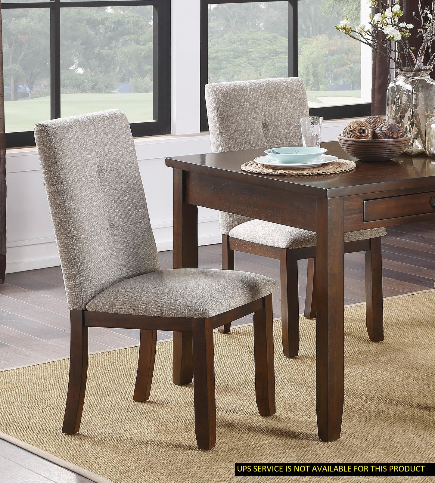Tufted grey upholstered dining chair with dark wood legs