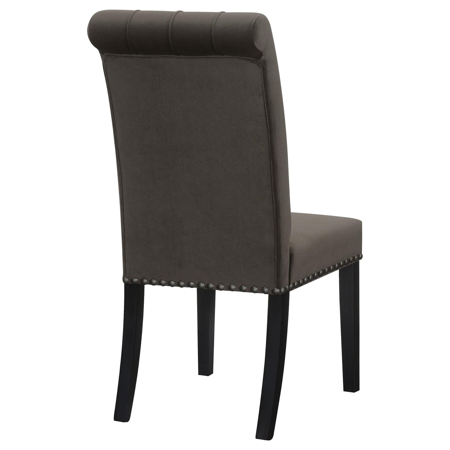 Tufted charcoal gray velvet dining chair with nailhead trim and dark wood legs