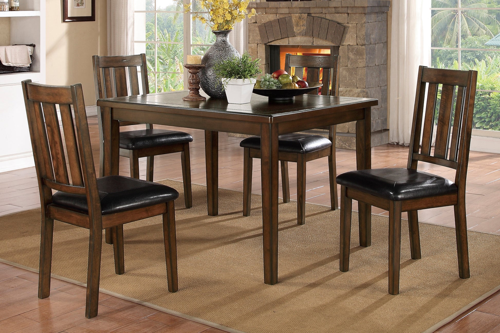 Dark wood dining table set with four upholstered chairs for a cozy dining room