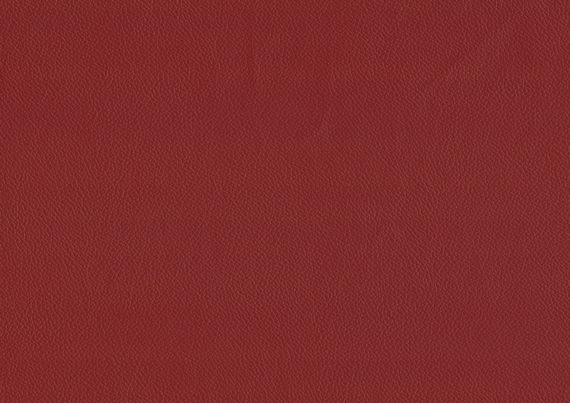Deep red textured leather upholstery perfect for furniture and car interiors