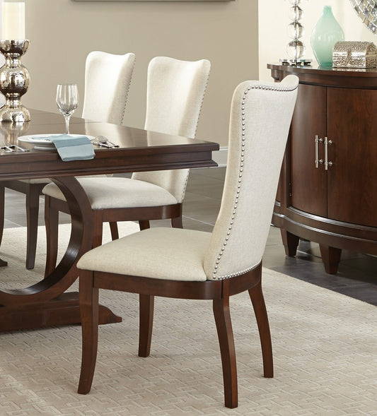 Upholstered dining chair with nailhead trim and solid wood legs