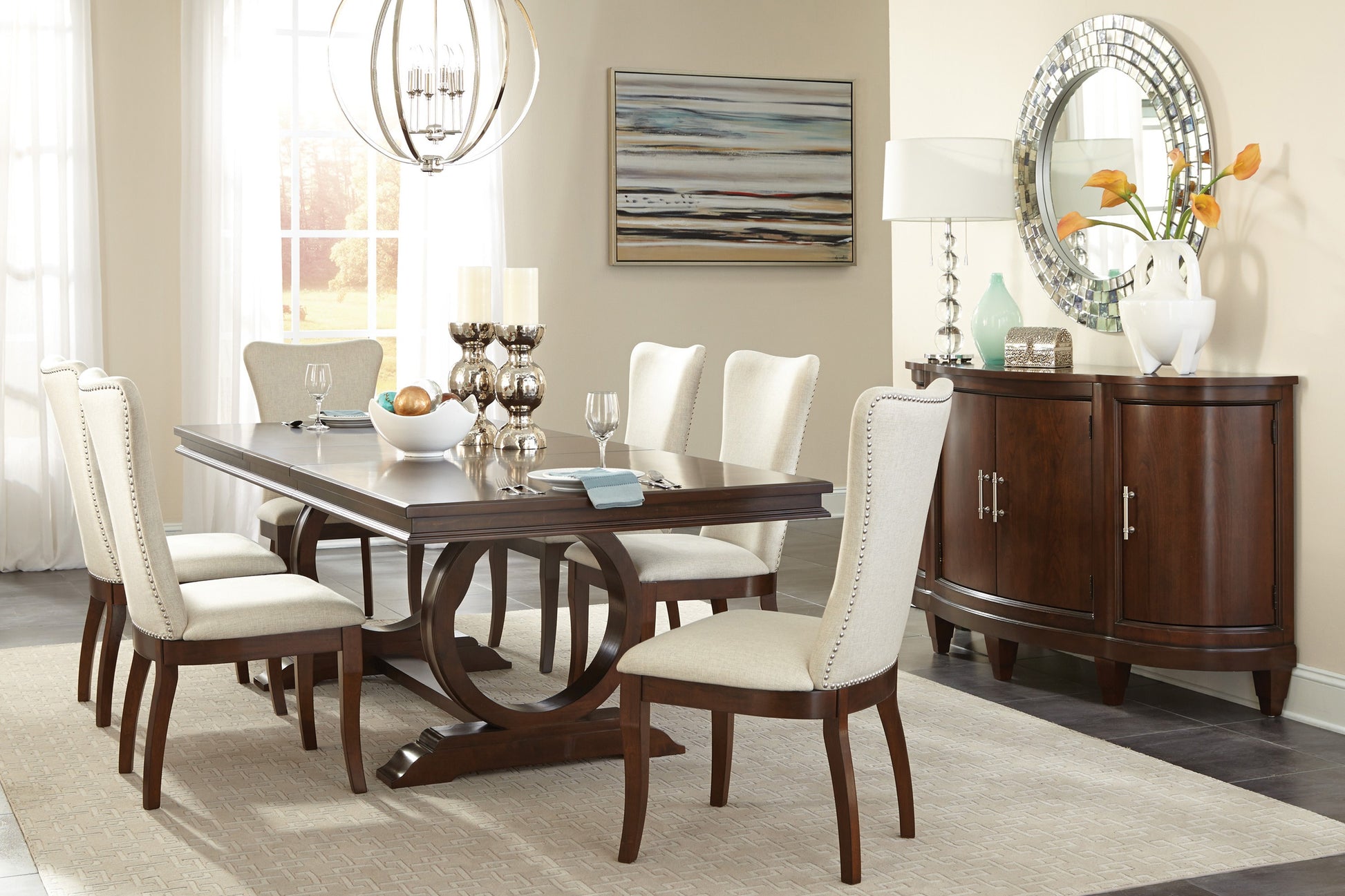 Dark wood dining table with pedestal base seating six upholstered chairs