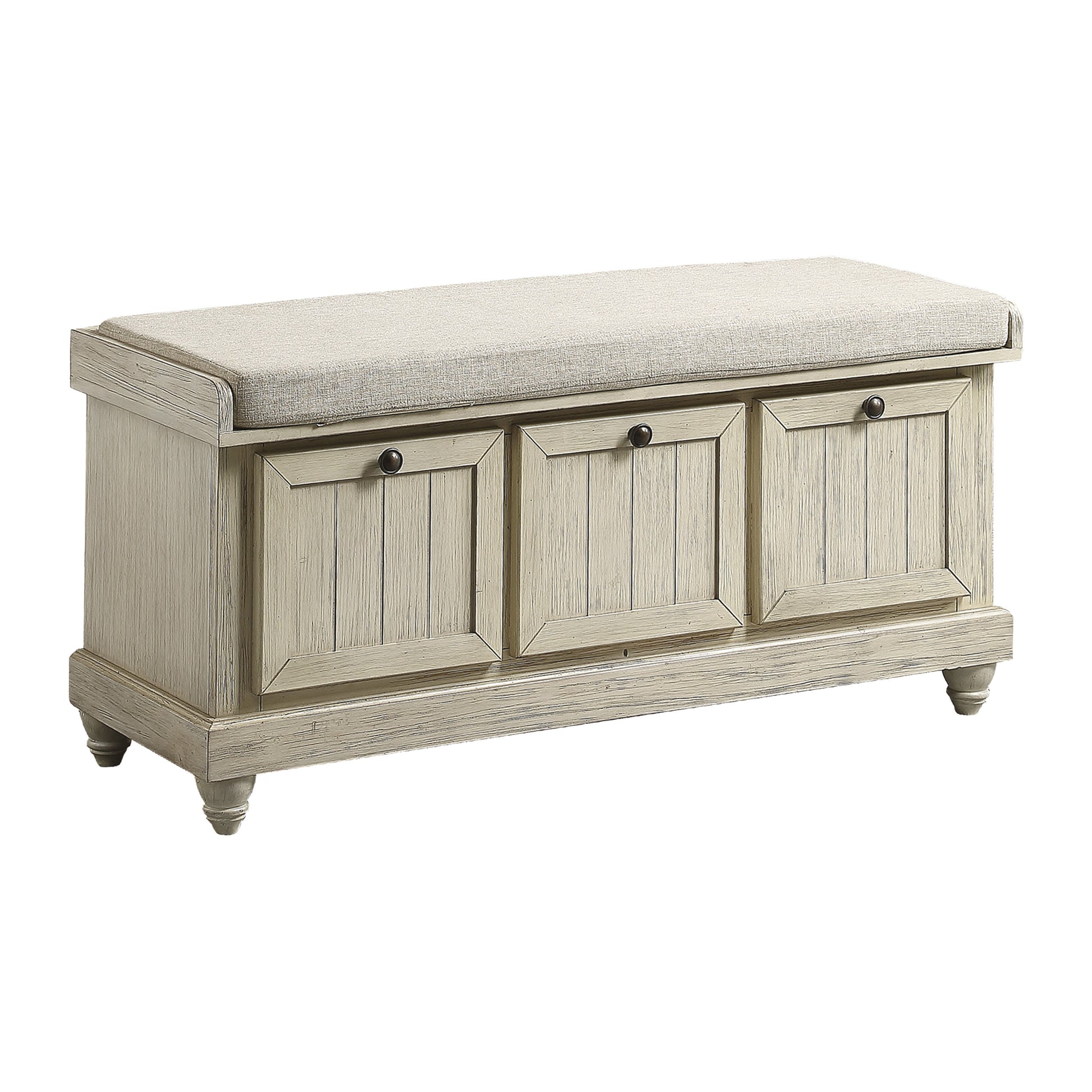 Whitewashed wood storage bench with cushioned seat and three paneled drawers