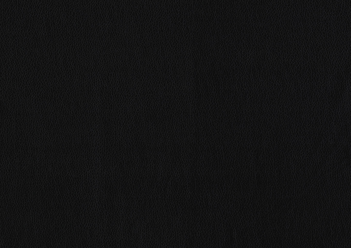 Closeup of a black vegan leather texture with a fine grain for upholstery projects