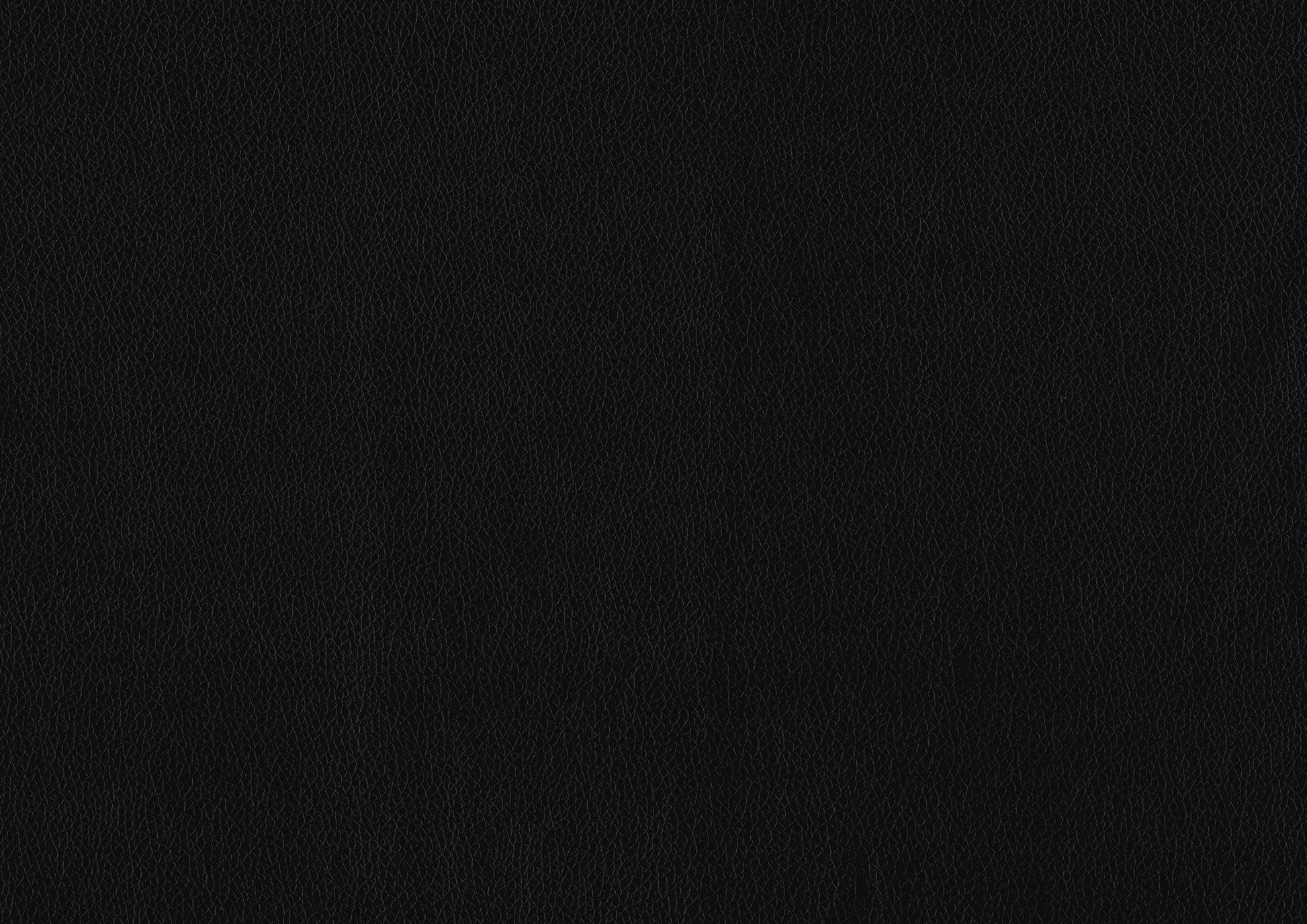 Closeup of a black vegan leather texture with a fine grain for upholstery projects