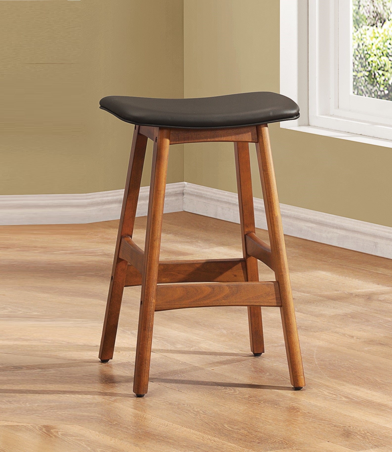 A dark brown faux leather counter stool with a wooden frame perfect for a kitchen island