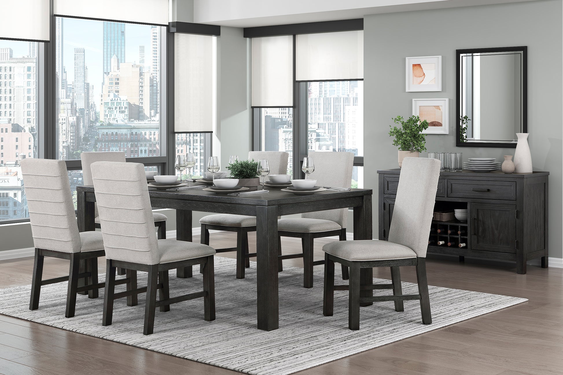 Dark wood dining table with six upholstered chairs on a striped rug