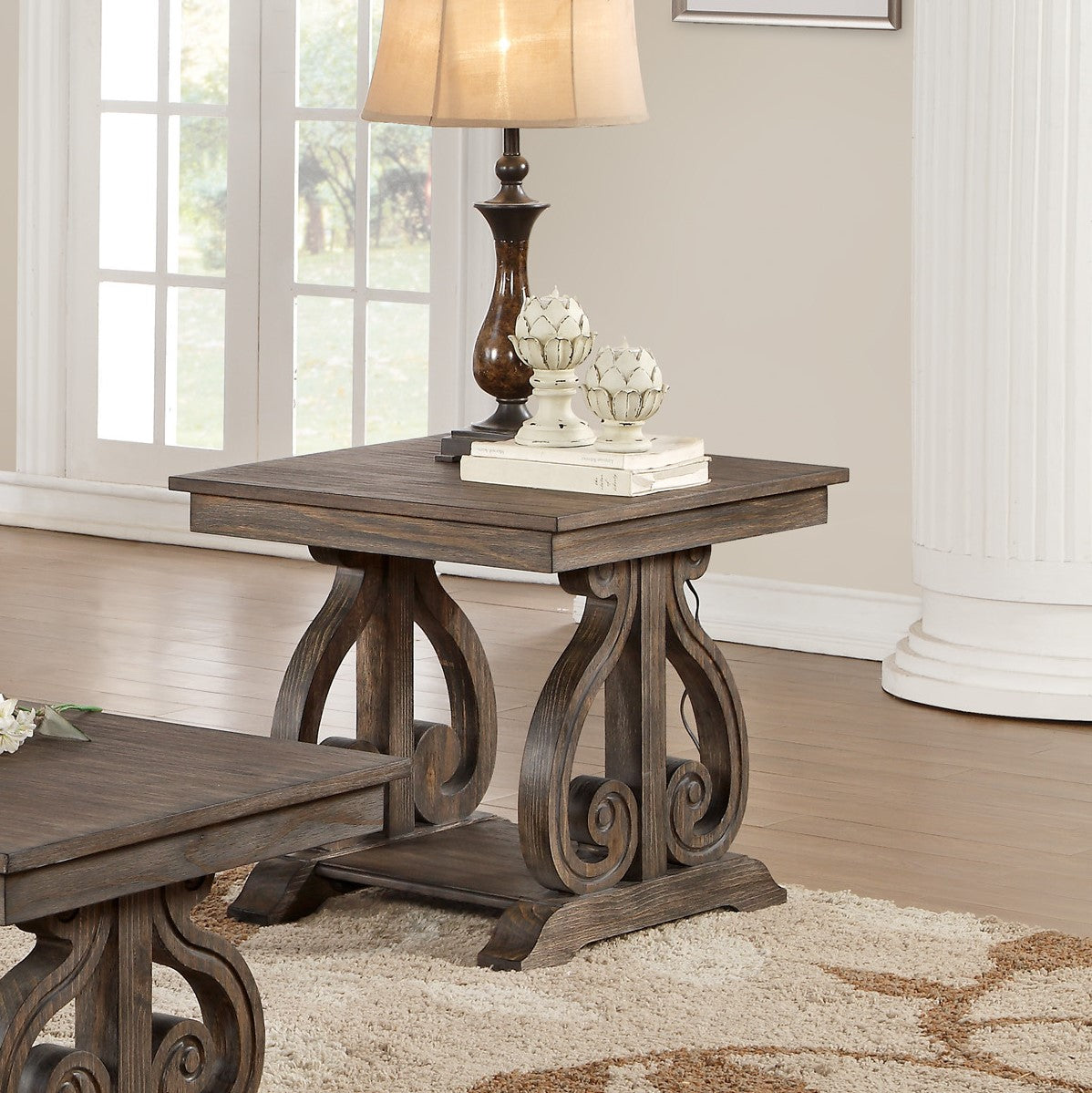 Dark wood end table with carved scrollwork legs and a rustic finish