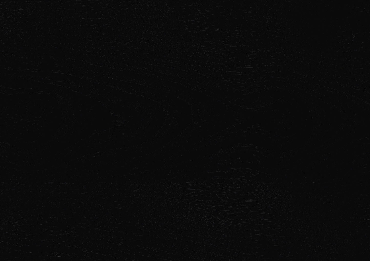 Textured black leather swatch for upholstery or fashion accessories