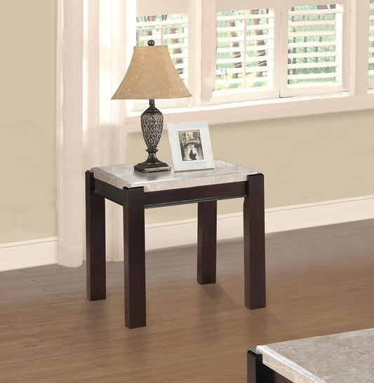 Dark wood end table with faux marble top and decorative lamp