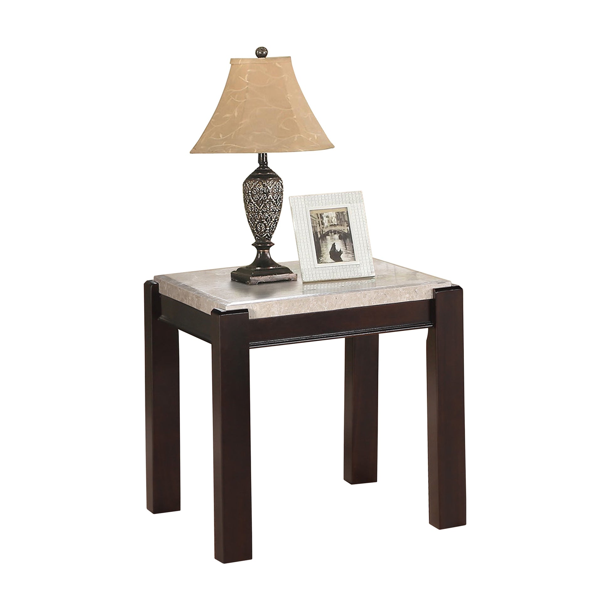 Dark wood end table with marble top featuring a decorative lamp and photo frame