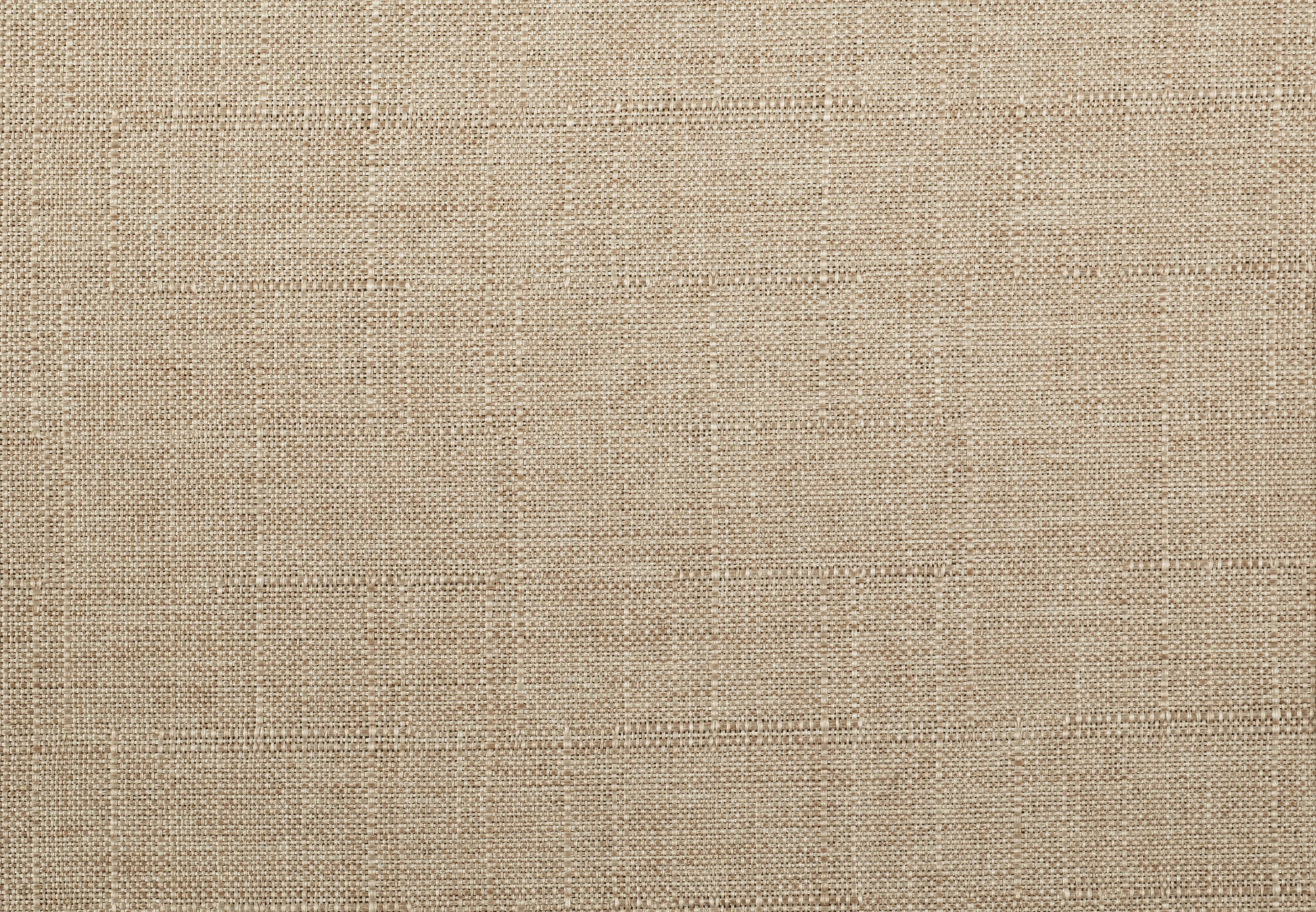 Closeup texture of natural beige linen fabric with visible weave pattern perfect for upholstery