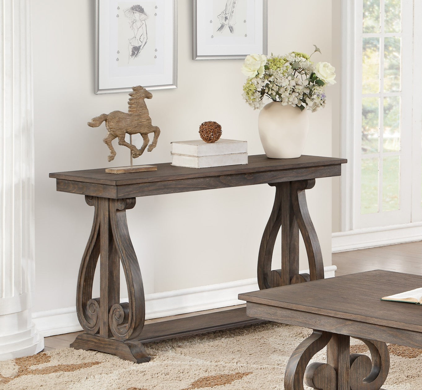 Dark wood console table with ornate scroll legs and decorative horse figurine