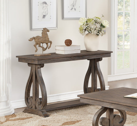 Dark wood console table with ornate scroll legs and decorative horse figurine