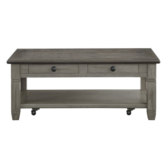 Gray wood coffee table with two drawers and lower shelf on casters